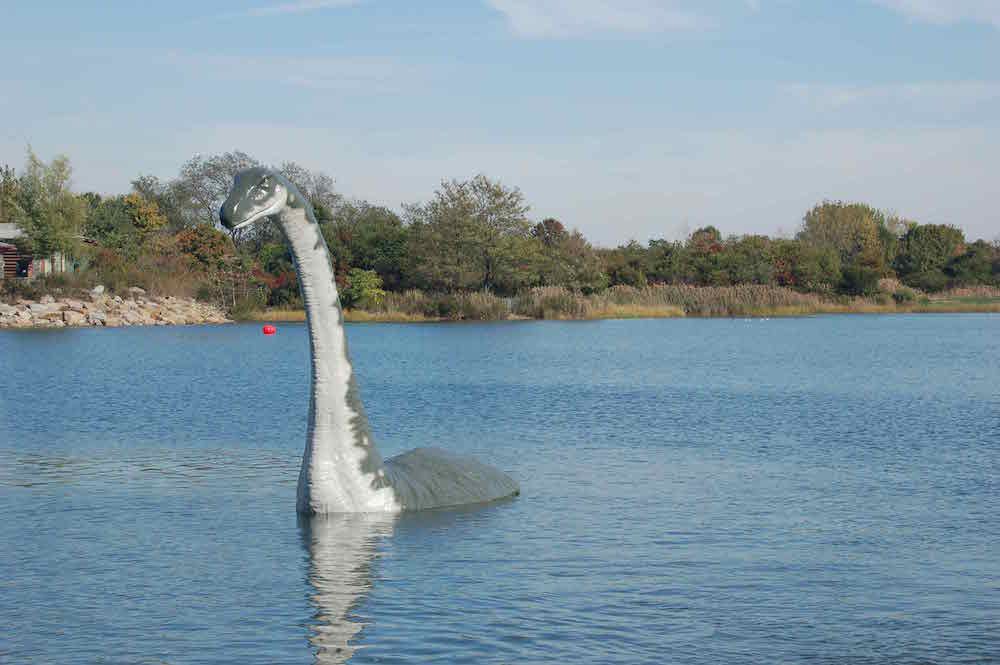 Cameron Gainer, Nessie, 2007, Marine Park, Brooklyn, NYC Parks. Cameron Gainer staged a replica of the mythic serpent in the salt marsh off of Marine Park. On the morning of April 19, 1934, British gynecologist Robert Kenneth Wilson supposedly shot a photograph of the Loch Ness Monster. The image quickly became the most iconic and recognized photo of the elusive serpent. It was not until 1994 that it was revealed as a hoax.<br/>